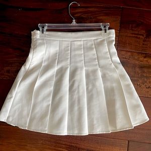 High waisted, pleated skirt